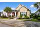 Inviting single-story home with a well-maintained lawn and an inviting front porch at 1404 Riverport Dr., Conway, SC 29526