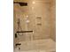 Updated bathroom features a tiled shower and soaking tub at 1426 Saint Thomas Circle # A 3, Myrtle Beach, SC 29577