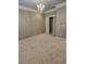 Neutral toned bedroom boasts a closet and hanging chandelier at 1426 Saint Thomas Circle # A 3, Myrtle Beach, SC 29577