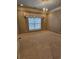 Bedroom with neutral walls and trim features one window and tan carpet at 1426 Saint Thomas Circle # A 3, Myrtle Beach, SC 29577