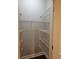 Walk-in closet with white metal storage shelves at 1426 Saint Thomas Circle # A 3, Myrtle Beach, SC 29577