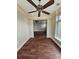 Open dining room featuring dark wood floors, white trim, and an elegant ceiling fan at 1426 Saint Thomas Circle # A 3, Myrtle Beach, SC 29577