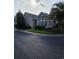 Charming brick home featuring manicured bushes, mature trees and well-maintained landscaping at 1426 Saint Thomas Circle # A 3, Myrtle Beach, SC 29577