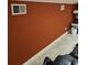 Lower level gym features an exercise machine and accent wall at 1426 Saint Thomas Circle # A 3, Myrtle Beach, SC 29577