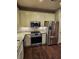 Kitchen featuring stainless-steel appliances, granite countertops, and shaker style cabinets at 1426 Saint Thomas Circle # A 3, Myrtle Beach, SC 29577