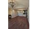 Spacious living room featuring an elegant chandelier and beautiful dark-wood flooring at 1426 Saint Thomas Circle # A 3, Myrtle Beach, SC 29577