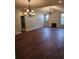 Large living room with a fireplace, high ceiling, and dark wood floors at 1426 Saint Thomas Circle # A 3, Myrtle Beach, SC 29577