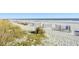 A beach landscape featuring vegetated dunes and views of the ocean at 1501 S Ocean Blvd. # 1232, Myrtle Beach, SC 29577