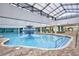 A sparkling indoor pool featuring a central fountain and a bright, open atmosphere at 1501 S Ocean Blvd. # 1232, Myrtle Beach, SC 29577