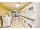 Clean laundry room with rows of stacked washers and dryers for residents' convenience at 1501 S Ocean Blvd. # 1232, Myrtle Beach, SC 29577