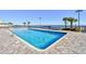 A sparkling outdoor pool with brick tile, set against a backdrop of the beach and ocean at 1501 S Ocean Blvd. # 1232, Myrtle Beach, SC 29577