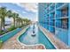 Scenic outdoor pool with water fountains, surrounded by palm trees and hotel balconies at 1501 S Ocean Blvd. # 1232, Myrtle Beach, SC 29577