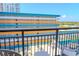 Enjoy resort views from a private balcony with comfortable seating at 1501 S Ocean Blvd. # 1410, Myrtle Beach, SC 29577