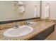 Bathroom vanity with granite countertop, sink, and mirror at 1501 S Ocean Blvd. # 1410, Myrtle Beach, SC 29577