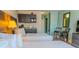 Bright bedroom with two beds, a kitchenette, table with chairs, and ample space at 1501 S Ocean Blvd. # 1410, Myrtle Beach, SC 29577