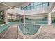 Inviting indoor hot tub with clear water, tile surround, and an open skylight at 1501 S Ocean Blvd. # 1410, Myrtle Beach, SC 29577