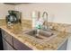 A well-appointed kitchenette with granite countertops and stainless steel sink at 1501 S Ocean Blvd. # 1410, Myrtle Beach, SC 29577