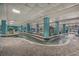 Resort indoor lazy river with clear water, columns, planters, and decorative tile surround at 1501 S Ocean Blvd. # 1410, Myrtle Beach, SC 29577