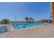 Outdoor pool with lounge seating and beautiful ocean views in a resort setting at 1501 S Ocean Blvd. # 1410, Myrtle Beach, SC 29577