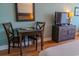 Cozy interior featuring a small table, two chairs, and a flat-screen TV at 1501 S Ocean Blvd. # 1410, Myrtle Beach, SC 29577