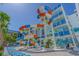 Exterior of resort waterpark featuring colorful waterslides, palm trees, and lounge seating at 1501 S Ocean Blvd. # 1410, Myrtle Beach, SC 29577