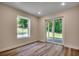 Basement room with natural light, sliding glass door access to the outdoors, and durable flooring at 1673 Carriage Ln., Little River, SC 29566