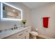 Bright bathroom featuring an LED mirror, white vanity, and a marble countertop with a modern sink and faucet at 1673 Carriage Ln., Little River, SC 29566