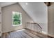 Upstairs space with light wood floors and window view at 1673 Carriage Ln., Little River, SC 29566