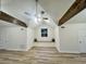 Bright bonus room with vaulted ceiling, wooden beams, and cozy window seats for added comfort at 1673 Carriage Ln., Little River, SC 29566