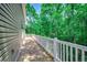 Spacious wood deck with white railings, perfect for outdoor relaxation and entertaining at 1673 Carriage Ln., Little River, SC 29566