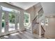 Bright entryway with natural light, and modern staircase at 1673 Carriage Ln., Little River, SC 29566