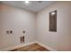 Laundry room with vinyl flooring and utility connections at 1673 Carriage Ln., Little River, SC 29566