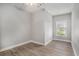 This bedroom has a ceiling fan, a window, and wood-look flooring at 2029 Silvercrest Dr. # 22B, Myrtle Beach, SC 29579