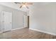 This bedroom has wood-look floors, a ceiling fan, and doors to other rooms at 2029 Silvercrest Dr. # 22B, Myrtle Beach, SC 29579