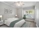 Bright bedroom with a ceiling fan, hardwood floors, and a large window with natural light at 2029 Silvercrest Dr. # 22B, Myrtle Beach, SC 29579