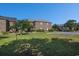 Exterior view of brick apartment buildings with green lawns and parking area at 2029 Silvercrest Dr. # 22B, Myrtle Beach, SC 29579