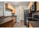 A kitchen featuring stainless steel appliances, wood cabinets and modern countertops at 2029 Silvercrest Dr. # 22B, Myrtle Beach, SC 29579