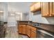 A kitchen and dining area featuring stainless steel appliances, wood cabinets and modern countertops at 2029 Silvercrest Dr. # 22B, Myrtle Beach, SC 29579