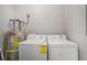 The laundry area includes a washer, dryer, and hot water heater at 2029 Silvercrest Dr. # 22B, Myrtle Beach, SC 29579