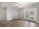 Bright living room featuring hardwood floors, a ceiling fan, and access to the outdoor space at 2029 Silvercrest Dr. # 22B, Myrtle Beach, SC 29579