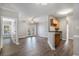 Spacious living room featuring hardwood floors, crown molding, and a view to the kitchen at 2029 Silvercrest Dr. # 22B, Myrtle Beach, SC 29579