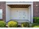 A ground-level patio is accessible through white French doors at 2029 Silvercrest Dr. # 22B, Myrtle Beach, SC 29579