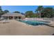 A pristine outdoor swimming pool with lounge chairs and shaded area at 2029 Silvercrest Dr. # 22B, Myrtle Beach, SC 29579