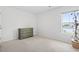 Simple bedroom with a light green dresser and a window bringing in natural light at 205 Marsh Deer Place, Surfside Beach, SC 29575