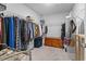 Walk-in closet with organized shelving, hanging racks, and a decorative wooden chest at 205 Marsh Deer Place, Surfside Beach, SC 29575