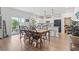 Spacious dining area adjacent to the kitchen, featuring hardwood floors and sliding glass doors at 205 Marsh Deer Place, Surfside Beach, SC 29575