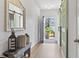 Bright entryway featuring hardwood floors, shiplap accent wall, and stylish barn doors at 205 Marsh Deer Place, Surfside Beach, SC 29575