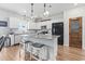 Modern kitchen with granite countertops, stainless steel appliances, and an island with bar seating at 205 Marsh Deer Place, Surfside Beach, SC 29575