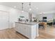 Open kitchen with a large island, granite countertops, and pendant lighting at 205 Marsh Deer Place, Surfside Beach, SC 29575