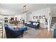 Inviting living room with a view into the kitchen, blue sofas, and hardwood floors at 205 Marsh Deer Place, Surfside Beach, SC 29575